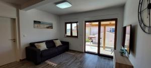 Posedenie v ubytovaní Luxury Apartment near the beach with Private Pool -Exclusive Use