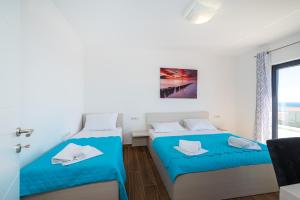 Postel nebo postele na pokoji v ubytování Villa Laura View
