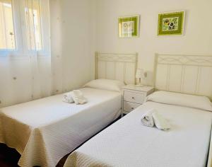 Postel nebo postele na pokoji v ubytování Casa Playa Roquetas