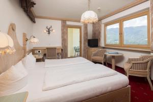Posteľ alebo postele v izbe v ubytovaní Hotel Silberberger - Wildschönau