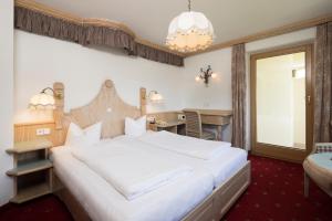 Posteľ alebo postele v izbe v ubytovaní Hotel Silberberger - Wildschönau