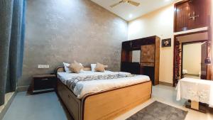 Voodi või voodid majutusasutuse Hotel Rajyashree Palace toas
