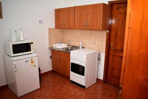 Kuchyň nebo kuchyňský kout v ubytování Nóra apartman