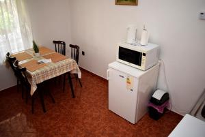 Kuchyň nebo kuchyňský kout v ubytování Nóra apartman
