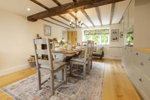 a kitchen and dining room with a table and chairs at Church View in Nunnington