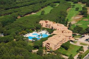 an aerial view of a large house with a swimming pool at La Costa Hotel Golf & Beach Resort in Pals