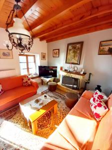a living room with a couch and a table at Orizontas Pilio Villa in Kissos