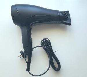 a black blow dryer with a cord plugged into it at Rooms Kata in Rovinj