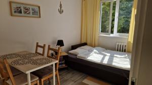Posteľ alebo postele v izbe v ubytovaní Apartament Morski
