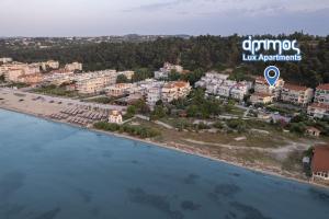 an aerial view of a beach in a resort at Ammos Lux Apartments in Agia Triada