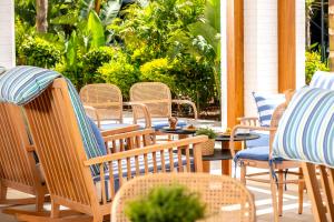 a group of chairs and tables on a patio at NissiBlu Beach Resort in Ayia Napa