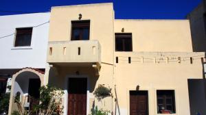 a house in the middle of a street at Volcano View Nisyros in Mandrákion