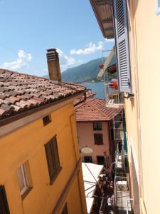 a view from a balcony of buildings with a view of the water at Appartamento Il Borgo in Bellagio