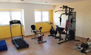 a gym with several exercise equipment in a room at Hotel Dora in Termas de Río Hondo