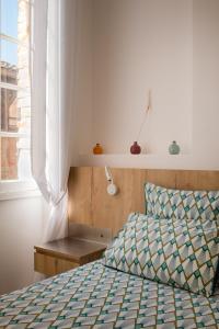 Postel nebo postele na pokoji v ubytování Appartement d'exception au pied de la cathédrale