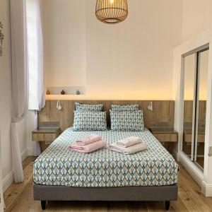 Postel nebo postele na pokoji v ubytování Appartement d'exception au pied de la cathédrale