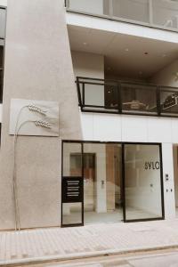 a building with a sign on the side of it at SYLO Luxury Apartments - LVL 2 in Adelaide