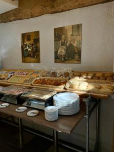 a table with a bunch of bread and pastries at Elbershof Monschau in Monschau