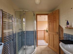 a bathroom with a shower and a tub and a sink at Spacious Unique Brighton Home FREE Parking in Brighton & Hove