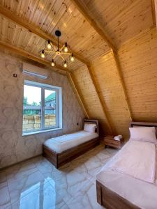 Llit o llits en una habitació de Gabala Chesnut Villa Resort