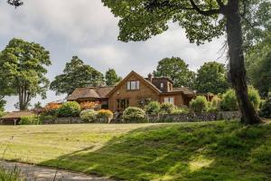 an exterior view of a house with a yard at Millwood in Horstead