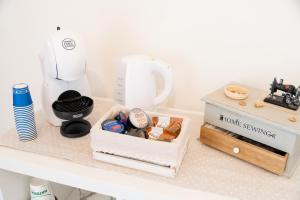 a kitchen counter with a blender and a box of food at Trullo Dimora Zaccaria in Alberobello +12 photos