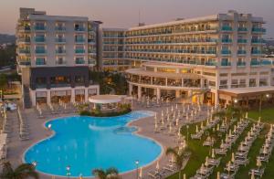 an aerial view of a resort with a swimming pool at NissiBlu Beach Resort in Ayia Napa