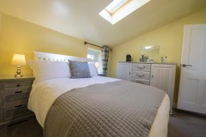 Un pat sau paturi într-o cameră la Witton View