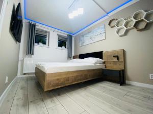 Postel nebo postele na pokoji v ubytování Apartament 400 m od molo Międzyzdroje