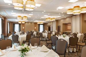 a banquet room with white tables and chairs at Hyatt Place Houston/The Woodlands in The Woodlands