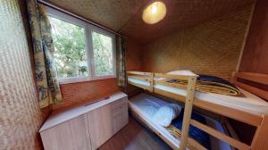Postel nebo postele na pokoji v ubytování Chalet des Lucioles + 6 fotografií