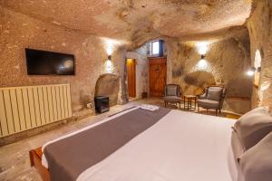 TV a/nebo společenská místnost v ubytování Canyon Cave Hotel
