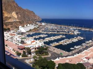 an aerial view of a marina with boats in the water at PRIMERA LÍNEA DE PLAYA, LA ARENA A TUS PIES in Aguadulce