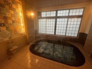 Koupelna v ubytování Historical Ryokan SENYUKAN