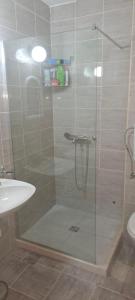 a shower with a glass door in a bathroom at Masa in Baošići
