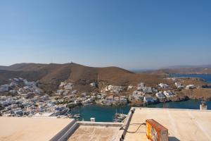 an aerial view of a town with a harbor at Karai traditional house in Astypalaia Town