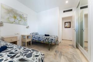 Łóżko lub łóżka w pokoju w obiekcie Golden Beach Elviria