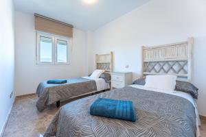 Posteľ alebo postele v izbe v ubytovaní Apartamento Cala de mijas