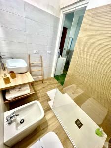 a bathroom with a sink and a mirror at Terrazze Sul Mare in Pozzallo