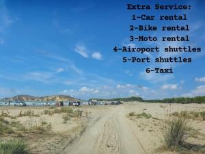 a road in the desert under a blue sky at Arlind's Apartaments in Vlorë