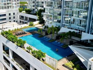 an overhead view of a swimming pool in a building at 1br Apartments Mactan New Town free Pool free Beach near Airport Ocean view in Punta Engaño