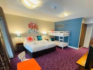 Posteľ alebo postele v izbe v ubytovaní Osprey Hotel