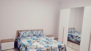 a bedroom with a bed and a mirror at Lovin Puglia Vacation in Bari