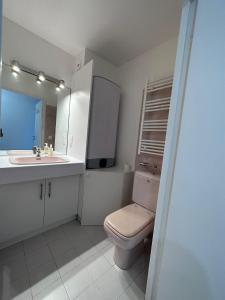 a bathroom with a toilet and a sink and a mirror at Studio Antibes Port Vauban. in Antibes