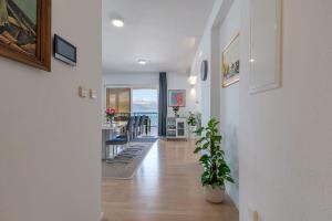 a hallway of a home with a view of the ocean at Beachfront Apartment with parking in Slatine