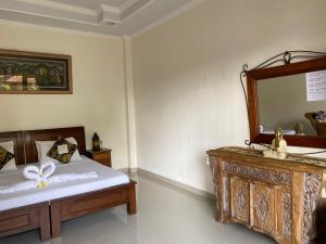 Postel nebo postele na pokoji v ubytování Ben's Homestay