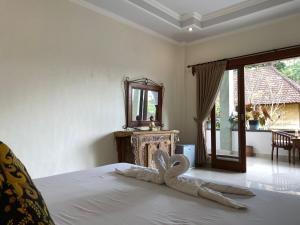 Postel nebo postele na pokoji v ubytování Ben's Homestay