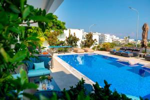 a swimming pool on top of a building at Fig Tree Bay Residences 7 in Protaras