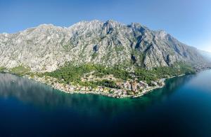 an island in the middle of a large body of water at Villa Shah Complex in Kotor