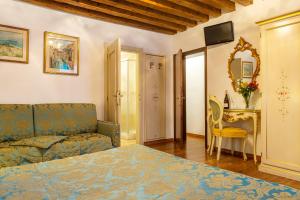 Postel nebo postele na pokoji v ubytování Hotel Al Vagon
